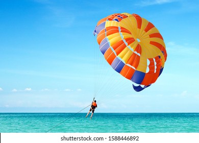 Parasailing On Tropical Beach In Summer. 