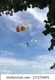 Parashoot flying on the sky near the seaside