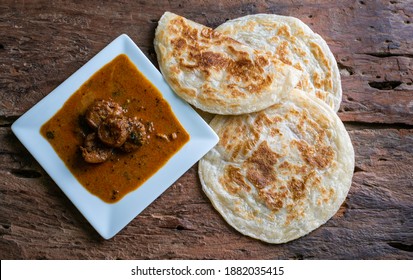 Paratha,Parata, Parotha With Sri Lankan Style Spicy Prawns Curry