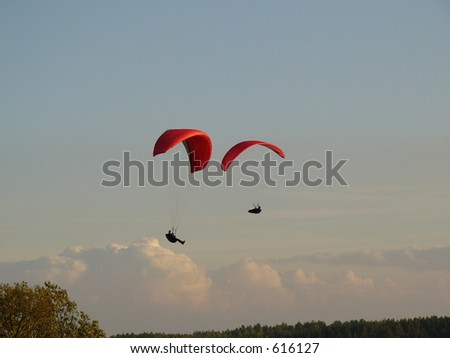 Paratroopers hover in the sky