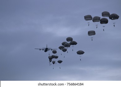 Paratroopers Jump From Military Plane On Evening