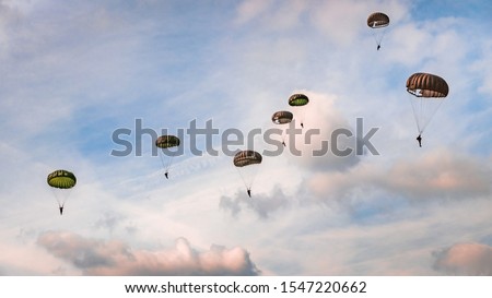 Paratroopers reenacting a jump from a world war 2 (ww2) Dakota airplane during Operation Market Garden in Holland/the Netherlands. During the 75 year commemoration at 17th september 2019, Schijndel.