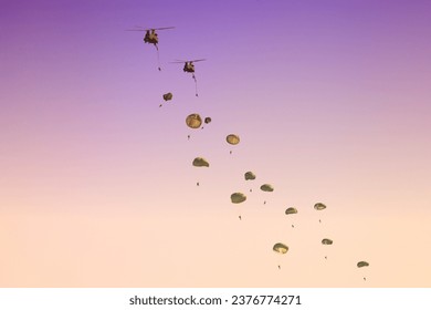 Paratroops jump from chinook helicopter 