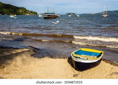 Paraty, Rio De Janeiro, Brazil, January 07, 2014. Fishing Boat Moored At Cabore Beach In The Municipality Of Paraty, South Coast Of The State Of Rio De Janeiro, Brazil