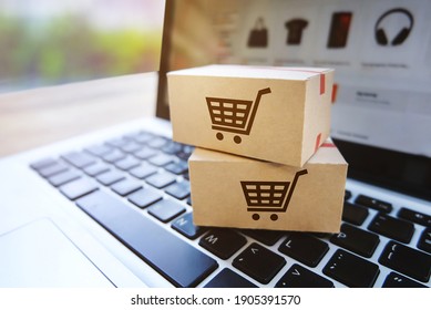 Parcel box on a laptop with Shopping service on the online website,E-commerce or online shopping concept. 