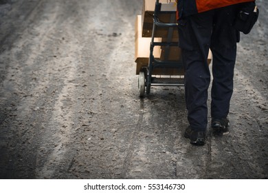 Parcel Delivery In Winter On Dirty Street