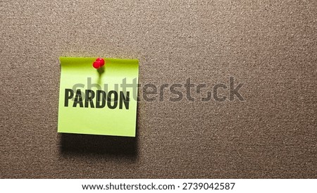 Pardon Message on Pinned Note Concept Representing Forgiveness, Apology, Legal Clemency, Mercy and Reconciliation Theme. 