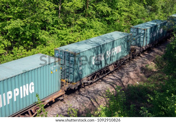 Pardubice Cerna za Bory, Czech republic /\
April 28, 2018 - Cargo train with China Shipping waggon containers\
run on the track in\
countryside