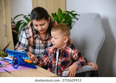Parent Assists Child Using Educational Device Happily. Mother And Son Engage With Tablet In Cheerful Learning Setting