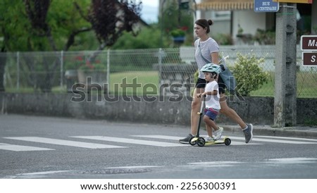 Similar – Image, Stock Photo Two men having fun riding bike and skateboard