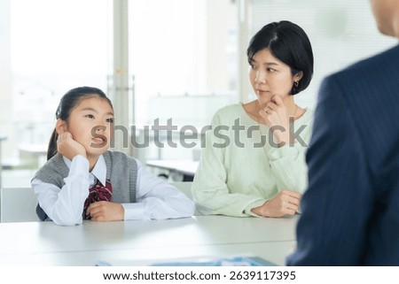 Parent and child having a three-way interview