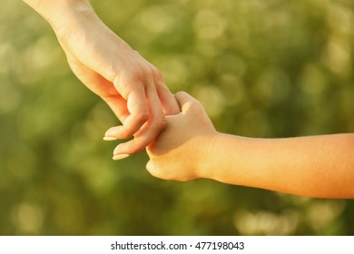 Parent And Child Holding Hands Outdoor
