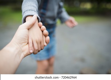 Parent And Child Playing In The Park