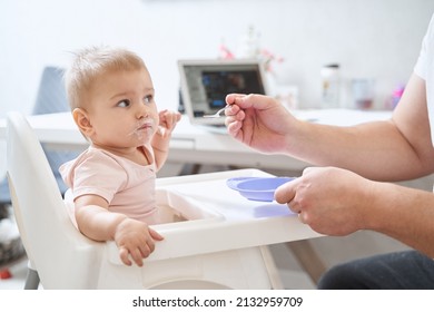 Parent Is Feeding Baby With Semolina Pudding