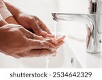 Parent, kid and washing of hands in bathroom for teaching healthy habits, hygiene support and disinfection in home. People, water and soap for dirt, bacteria prevention or cleaning routine by basin