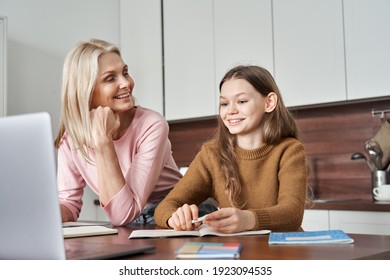 Parent Mom And Teen Daughter E Learning On Virtual Online Class At Home. Teenage Girl Distance Studying Virtual Remote Lesson On Video Call With Mother Looking At Laptop Computer. Remote Education