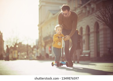 Parent Provides Unconditional Care And Love For The Child. Father And Son In The City.