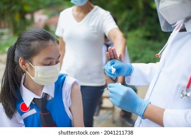 Parent Rejecting Vaccination Shot On Child School Student.Students Vaccine Shot In Malaysia.Girl Wearing Blue And White School Uniform.Anti Vaccine Parents.Anti-vaccine Protest On Teenager.