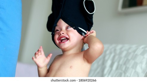 Parent Removing Baby Shirt, Clothing Stuck In Toddler Head, Mother Changing Child Clothing. Fun And Laughter