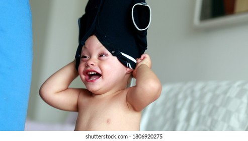 Parent Removing Baby Shirt, Clothing Stuck In Toddler Head, Mother Changing Child Clothing. Fun And Laughter