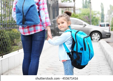 Parent Taking Child To School