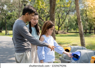 parent teach to children to throw empty plastic bottle into the garbage - Powered by Shutterstock