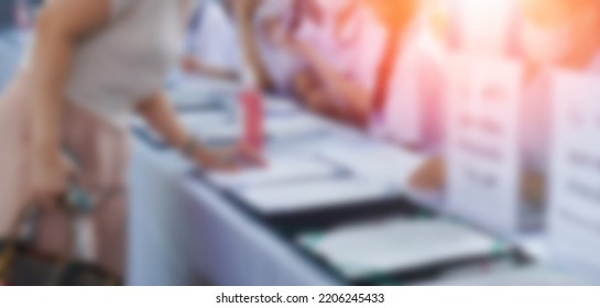 Parent Teacher Appointment PTA At School Concept. Blur Background Of Attendee Register Sign Up In Registration Paper Student At Desk In Front Of Education Conference.