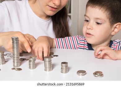 The Parent Teaches The Child How To Handle Money. Financial Literacy Course For Children Of Preschool And School Age.