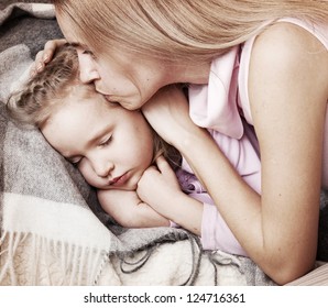 Parent Touching Forehead Sleeping Child. Illness Child