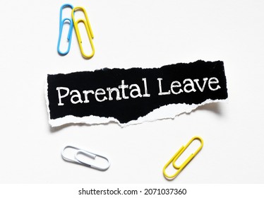 PARENTAL LEAVE words written on a black piece of paper. Concept for business.