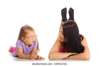 Parenthood And Children Upbringing. Mother Talking With Daughter Little Girl Isolated On White Background