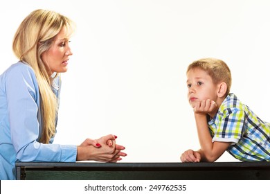 Parenthood  Domestic Life And Children Upbringing. Mother Talking With Son Little Sad Boy Isolated On White Background