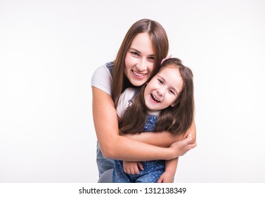 Parenting, Family And Children Concept - A Portrait Of A Mother And Her Baby Girl Have Fun And Smiling Over White Background