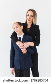 Parenting, Family And Single Parent Concept - A Happy Mother And Teen Son Smiling On White Background.