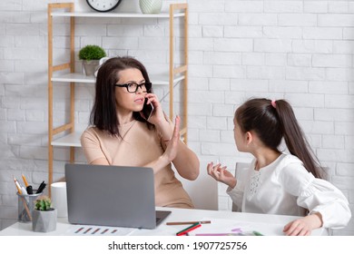 Parenting Problems During Coronavirus. Busy Working Mother Having No Time For Her Bored Daughter, Answering Business Phone Call At Home. Teen Girl Feeling Neglected By Her Mom During Lockdown