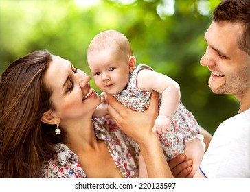 Parents With Baby In Park