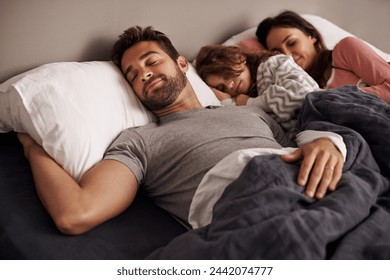 Parents, child and bed for sleep, dream and tired for rest, young and growing up for break indoor. Girl or kid with mom and dad and laying with pajamas for exhausted in house for peace and calm - Powered by Shutterstock