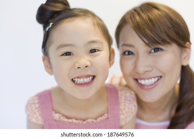 parents and child with big smile