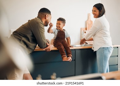 Parents, child and home of a fun, loving and caring family being playful with their son. Funny father making silly faces with his boy while having a laugh together with his wife in a kitchen.