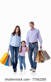 Parents With A Child With Shopping On White Background