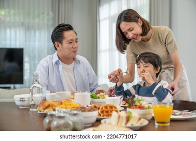 Parents and children are enjoying breakfast before going to work and school. - Powered by Shutterstock