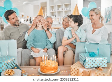 Parents, children and grandparents on sofa for birthday party with cake, games and blindfold for surprise in house. People, playful and kids on couch with present, excited and dessert at family home - Powered by Shutterstock