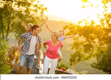 parents and children on vacation playing together outdoor - Shutterstock ID 406923250