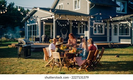 Parents, Children, Relatives and Friends Having an Open Air Barbecue Dinner in Their Backyard. Old and Young People Talk, Chat, Have Fun, Eat and Drink. Garden Party Celebration in a Backyard. - Powered by Shutterstock