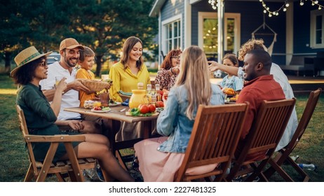 Parents, Children, Relatives and Friends Having an Open Air Vegetarian Dinner in Their Backyard. Old and Young People Talk, Chat, Have Fun, Eat and Drink. Garden Party Celebration in a Backyard. - Powered by Shutterstock