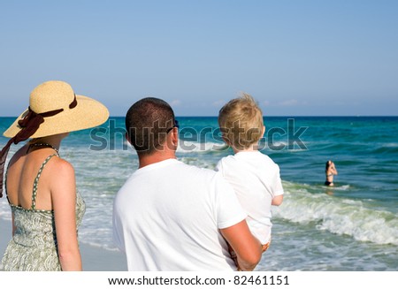 Parents and children spending time at the beach