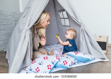 Parents With Children In A Teepee