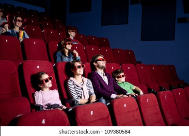 Parents With Children Watching A Comedy In 3D Movie