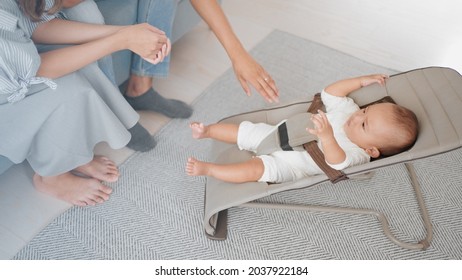 Parents comforting their baby at home - Powered by Shutterstock