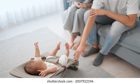 Parents comforting their baby at home - Powered by Shutterstock